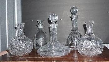 3 crystal decanters, 1 with etched horse, 1 ship's: 3 crystal decanters, 1 with etched horse, 1 ship's decanter & 2 cut glass water bottles, 20th century