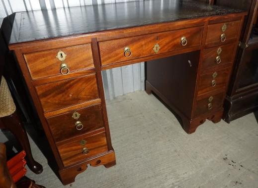 Vintage mahogany desk, 9 drawers with brass pulls,: Vintage mahogany desk, 9 drawers with brass pulls, leather top, ogee feet , 42" w x 24" d x 29" h, early 20th century
