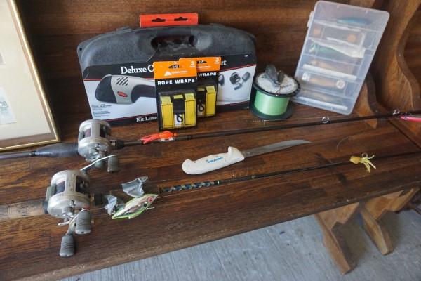 Collection of fishing gear: Collection of fishing gear: 2 rods & reels, Dexter filet knife, Deluxe cordless filet knife in box, rope wraps, lures, fishing line, 20th century