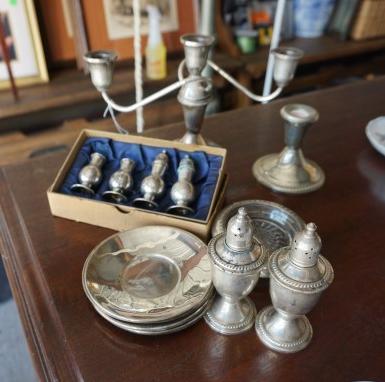 Collection of sterling: Collection of sterling: 3 arm candle opera, weighted candle stick, salt & pepper shaker, 2 crystal & silver coasters, 2 pairs of salt & pepper shakers in box (2 tops are missing), 6 saucers, 20th cent