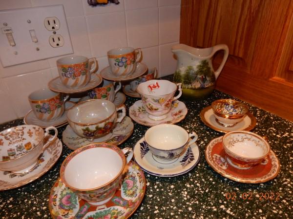 Porcelain Tea Cups: 12 porcelain tea cups & pottery pitcher: tea cups are from Japan, England, Germany, brands are Royal Albert, Delft, Rose Medallion, 20th century