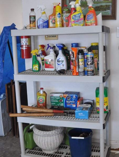 Shelving Units with Garden Supplies: 2 shelving units with garden supplies: pots, garden tools, hedge trimmer, battery charger, camp stove, potting soil, watering can, etc.