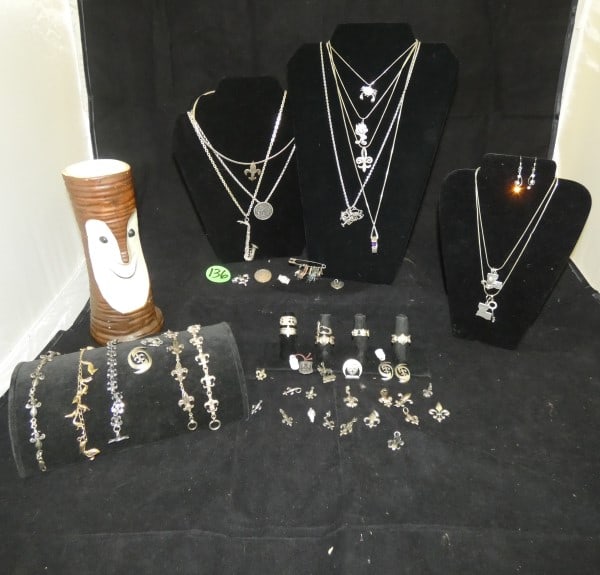 Collectibles from New Orleans: Collectibles from New Orleans: Bali Ha'I Tiki Cup from the Ponchartrain Beach, fleur-de-lis jewelry, New Orleans water meter jewelry, Rosenberg Furniture Store pendant, Louisiana boot, Pelican charm b