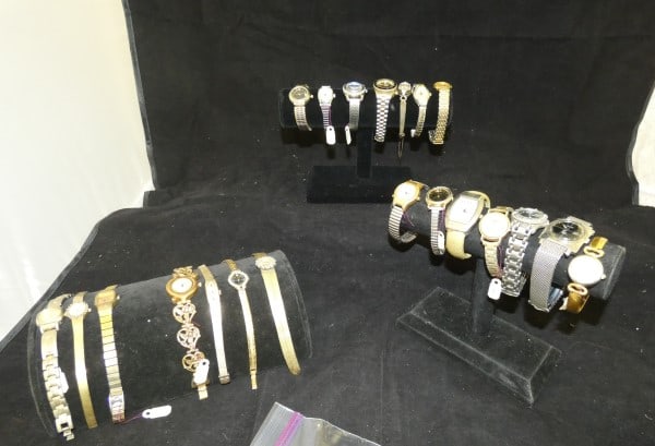 21 ladies fashion watches: 21 ladies fashion watches in gold & silver tones, some with stones:: Vanity Fair, No Boundaries, Gucci, Cherie, Elgin, Guess, Dearville, Austin, Pulsar, plus other brands, late 20th century