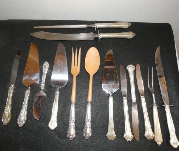 12 pieces of assortmented sterling serving pieces: 12 pieces of assortmented sterling serving pieces: salad set with sterling handles, wood fork & spoon, pie server & 3 knives, pie server & knife, knife with sharpener, meat fork, knife, pie server, ch