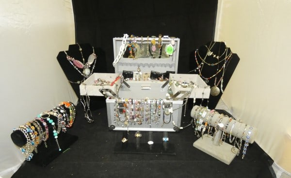 Jewelry case filled with eclectic jewelry: Jewelry case filled with eclectic jewelry including necklaces, earrings, bracelets rings,colorful cut stones & natural stones, mid to late 20th century