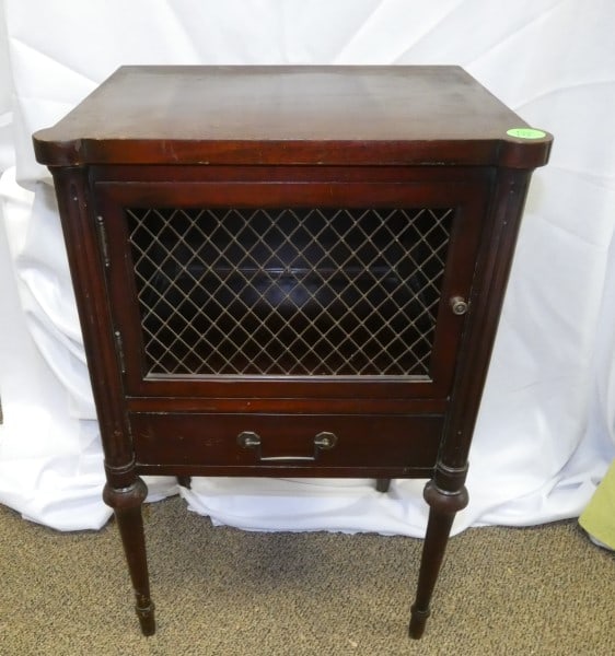Vintage mahogany side table: Vintage mahogany side table, brass mesh door insert, 1 drawer, made by Mahogany Association Inc., sold mahogany 18" w x 14 1/2" d x 28" h, mid 20th century