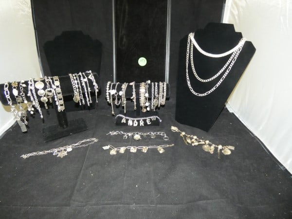 Vintage & Retro sterling jewelry: Vintage & Retro sterling jewelry, some with natural & cut stones: 33 sterling bracelets-most with charms & 1 with a watch, 3 sterling chains, 603 grams, (does not include bracelets with stones & watch