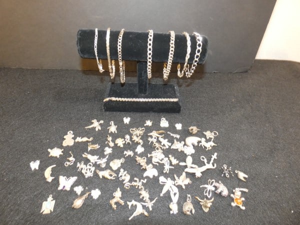 Vintage & Retro sterling jewelry: Vintage & Retro sterling jewelry: 8 charm bracelets 75 grams, 60+ charms, some with natural stones, 150 total grams, mid to late 20th century