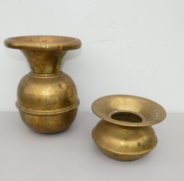 2 brass spittoons: 2 brass spittoons: 1 by "Faberware, Brooklyn, New York", weighted bottom 12" h, late 19th century,1 is 5 1/2" h, early 20th century