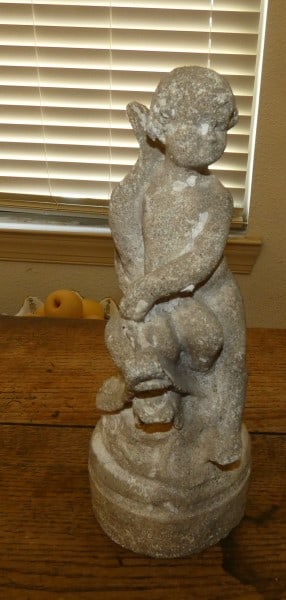 Concrete statue of a small boy with a dolphin: Concrete statue of a small boy with a dolphin 10" h, 20th century