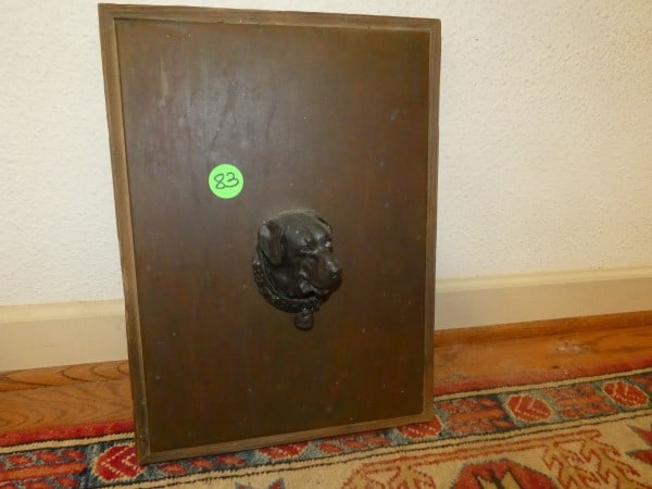 Wood panel with dog head door knocker (1 of 4)