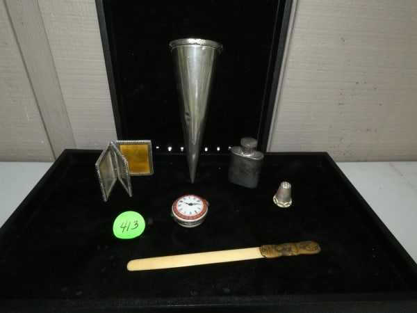 Collection of interesting items: Collection of interesting items including a pewter bud vase , small flask, clock face box, sterling triple picture frame 65.20 grams, brass & bone letter opener, silver thimble, 20th century