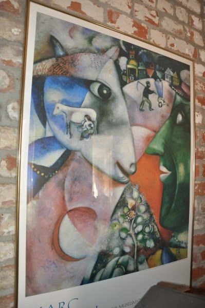 Framed poster by Marc Chagall, Metropolitan Museum of: Framed poster by Marc Chagall, Metropolitan Museum of Art, NYC, 3'6" H x 2'6" W & book "Chagalls World-Reflections from Mediterranean