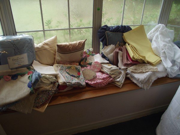 Large assortment of linens: place mats, napkins,: Large assortment of linens: place mats, napkins, pillows, comforters, coasters, misc.