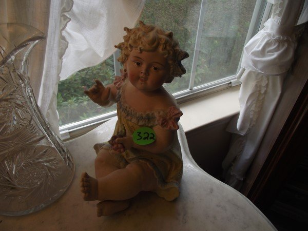 German bisque piano baby, 9" H: German bisque piano baby, 9" H