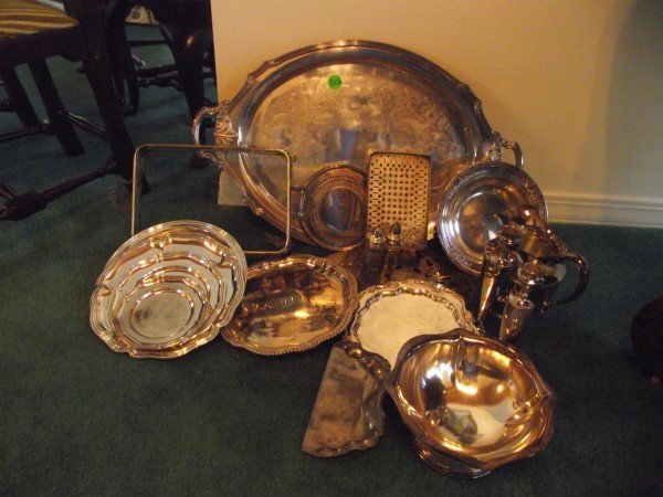 Large assortment of silver plate including tray (leg: Large assortment of silver plate including tray (leg to be repaired), bowls bowls, small trays, candle sticks, salt & pepper shakers, pitcher
