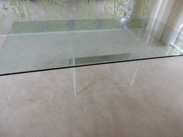 Glass dining table with acrylic & metal base (table top: Glass dining table with acrylic & metal base (table top has chips ) 7'3" L x 3'8" D x 2'4" H