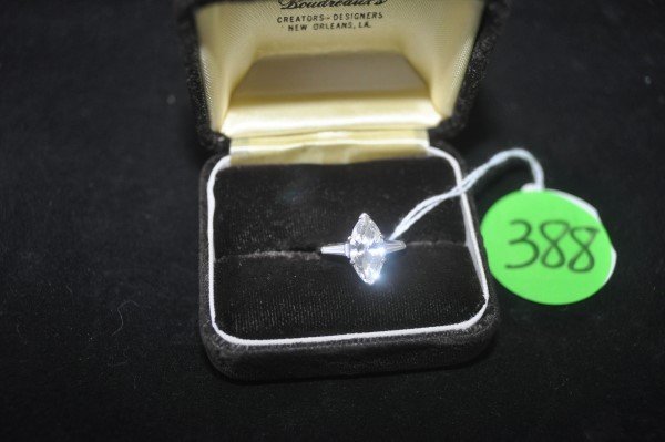 Marquis cut diamond engagement ring, flanked by a pair (1 of 5)