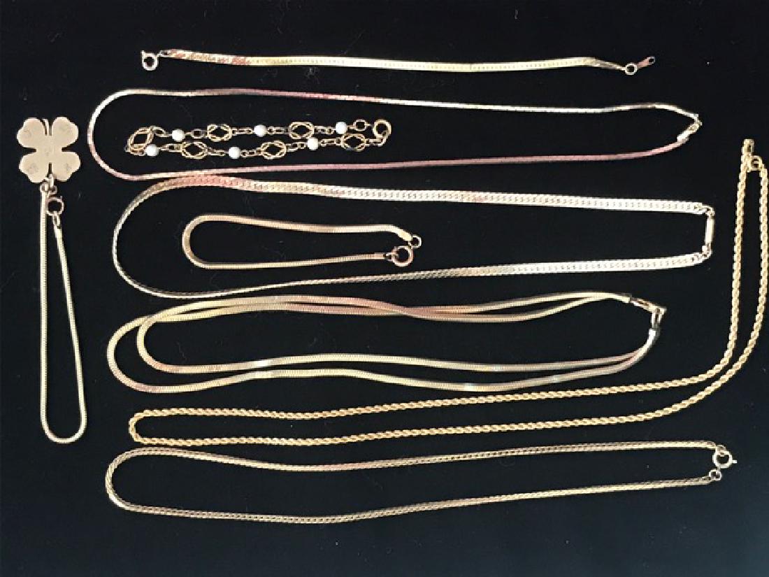 Lot of Gold Filled Chains & Bracelets: Marked 10, 12 and 14K gold filled. One bracelet with four leaf clover charm; one bracelet with faux pearls.
