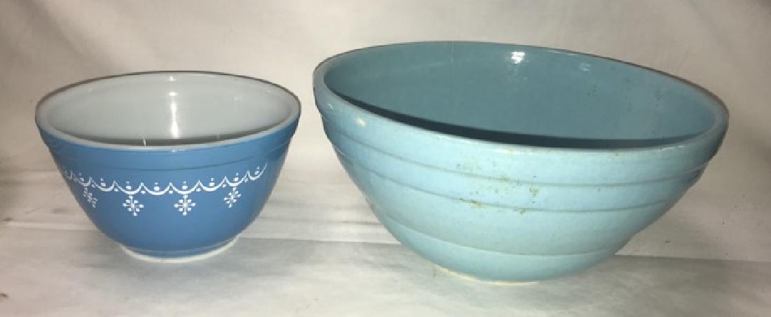 Two Mixing Bowls - Pottery and Pyrex: Blue pottery mixing bowl together withg a blue Pyrex bowl. 9" dia; 5-3/4" dia