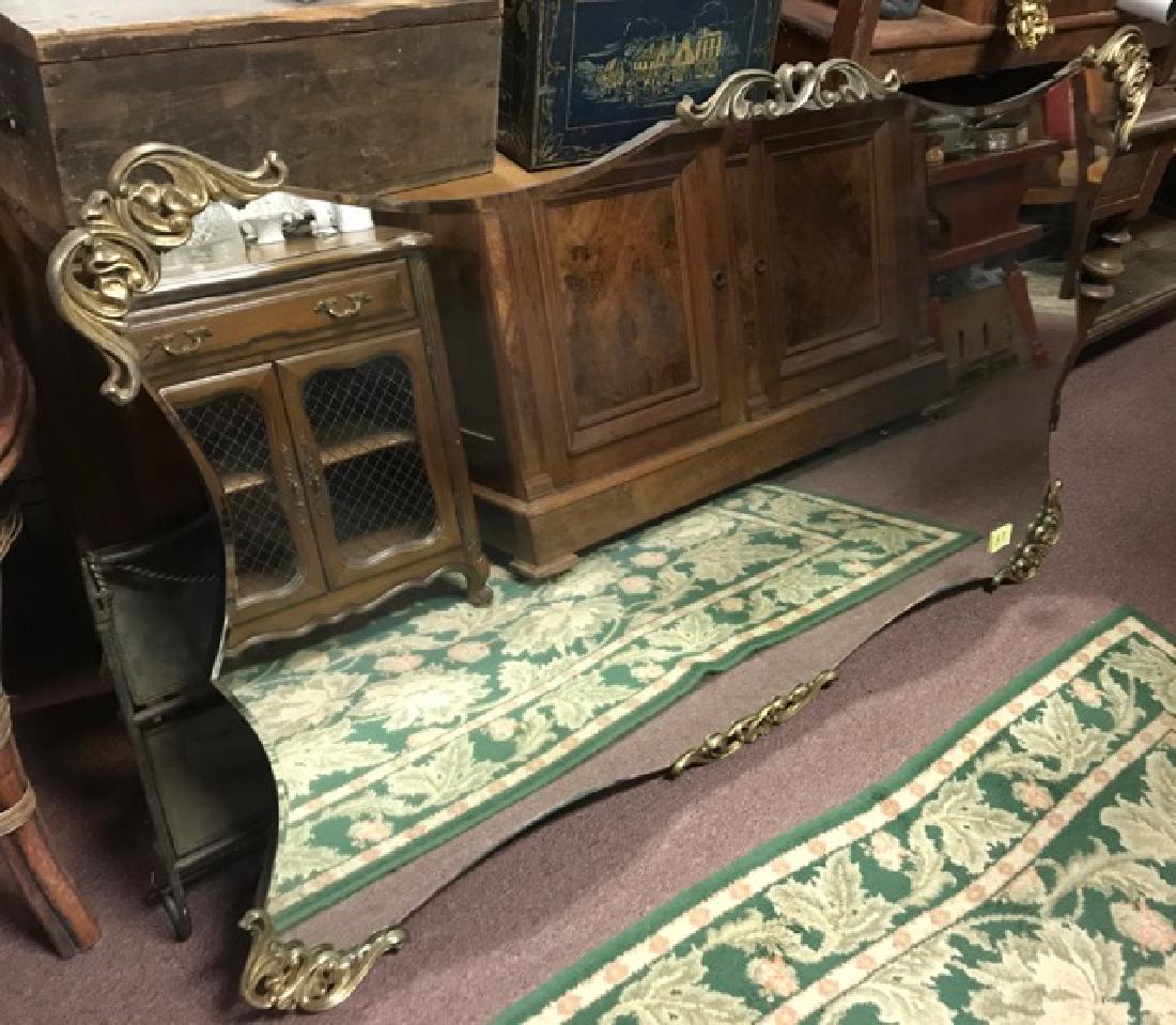 Large Beveled Edge Ormalu Mounte Mirror: Scroll metal decorations on corners and central top and bottom of mirror. Wood backed. Heavy. 56-1/2" x 35"