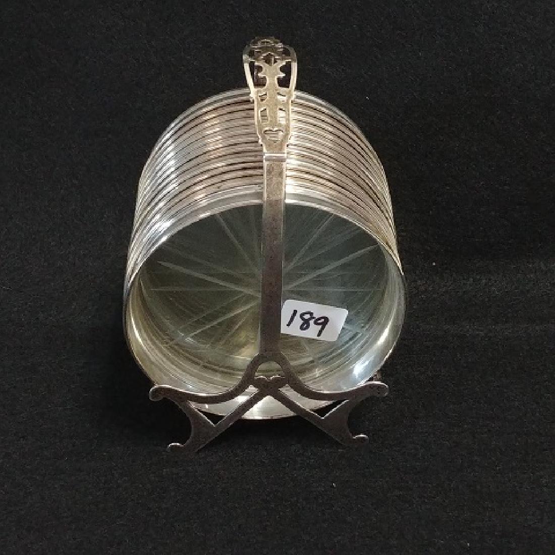 Sterling Silver and Crystal Coasters in Caddy: Twelve coasters in the lot. Marked Sterling. 3-1/2"