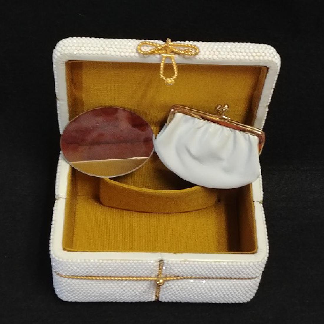 Judith Leiber Box Purse: White box purse with gilt metal trimming. Interior change purse and mirror. 6-1/4" x 4-1/4" x 3-1/2" high