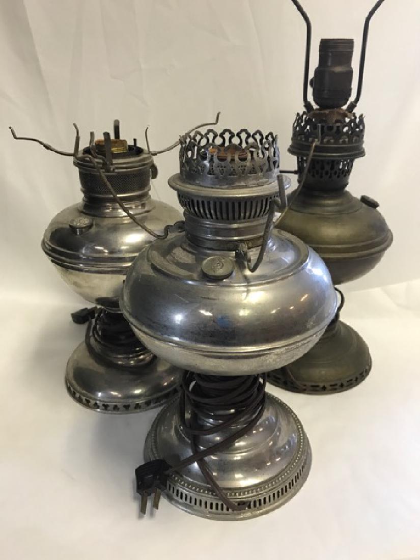 Electrified Nickel & Brass Oil Lamps: Brass lamp is an Aladdin. Nickel lamps are Rayo. 12" high; 11" high; 11" high