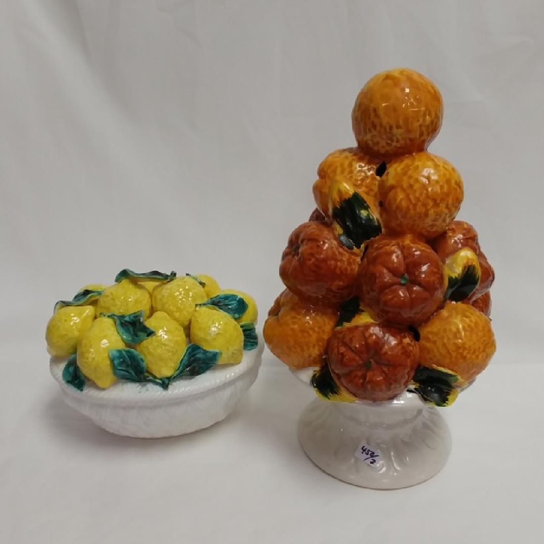 Pieces of Italian Pottery Fruit Decoration: One is a covered dish with lemons the other a pyramid display of oranges on a pedestal. 6" length ;12" high