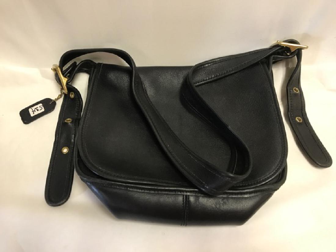 Leather Coach Handbag: Black leather shoulder saddle bag purse with zippered interior. 11" across