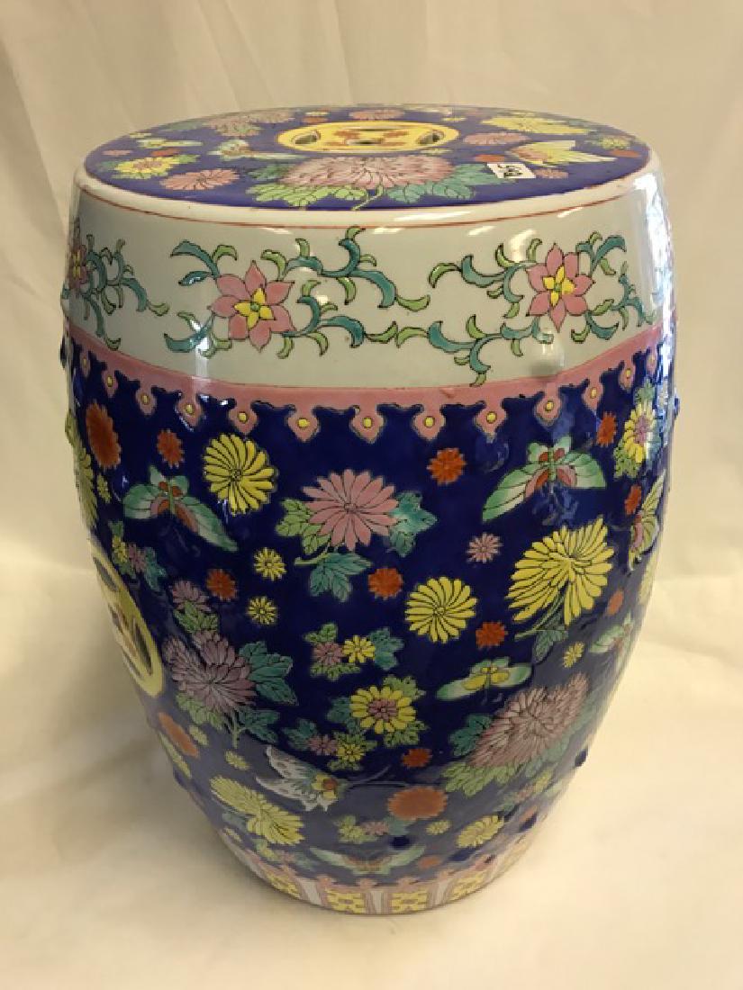 Oriental Garden Seat Porcelain: Cobalt blue field with butterflies and flowers. 18-1/2" high x 11" diameterr