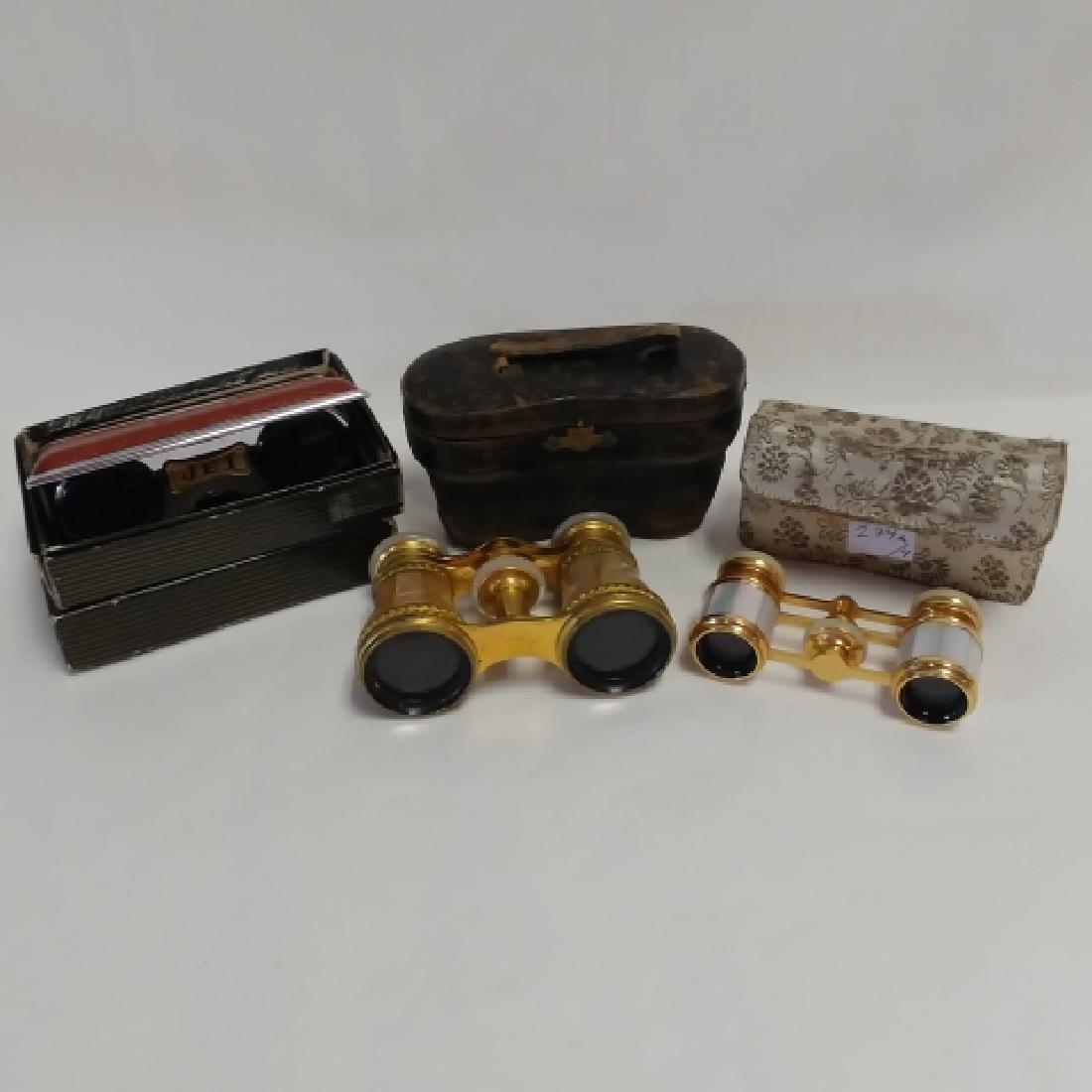 Four Pair of Opera Glasses: LeMaire FI Paris mother of pearl and gilt I worn leather case; petite French mother of pearl glasses marked France in satin case marked Made in France; and two pair of JET (Made in Japan) opera glasse