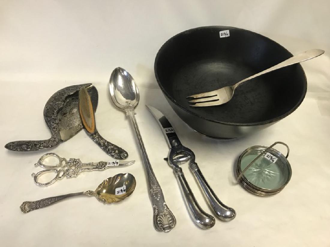 Dealer Lot of Sterling and Plated Silver (9): A walnut bowl with sterling base; a sterling meat fork; sterling spoon; plated chicken cutter; plated grape snippers; plated crumber and brush; plated serving spoon; 6 sterling coasters. Serving spoon