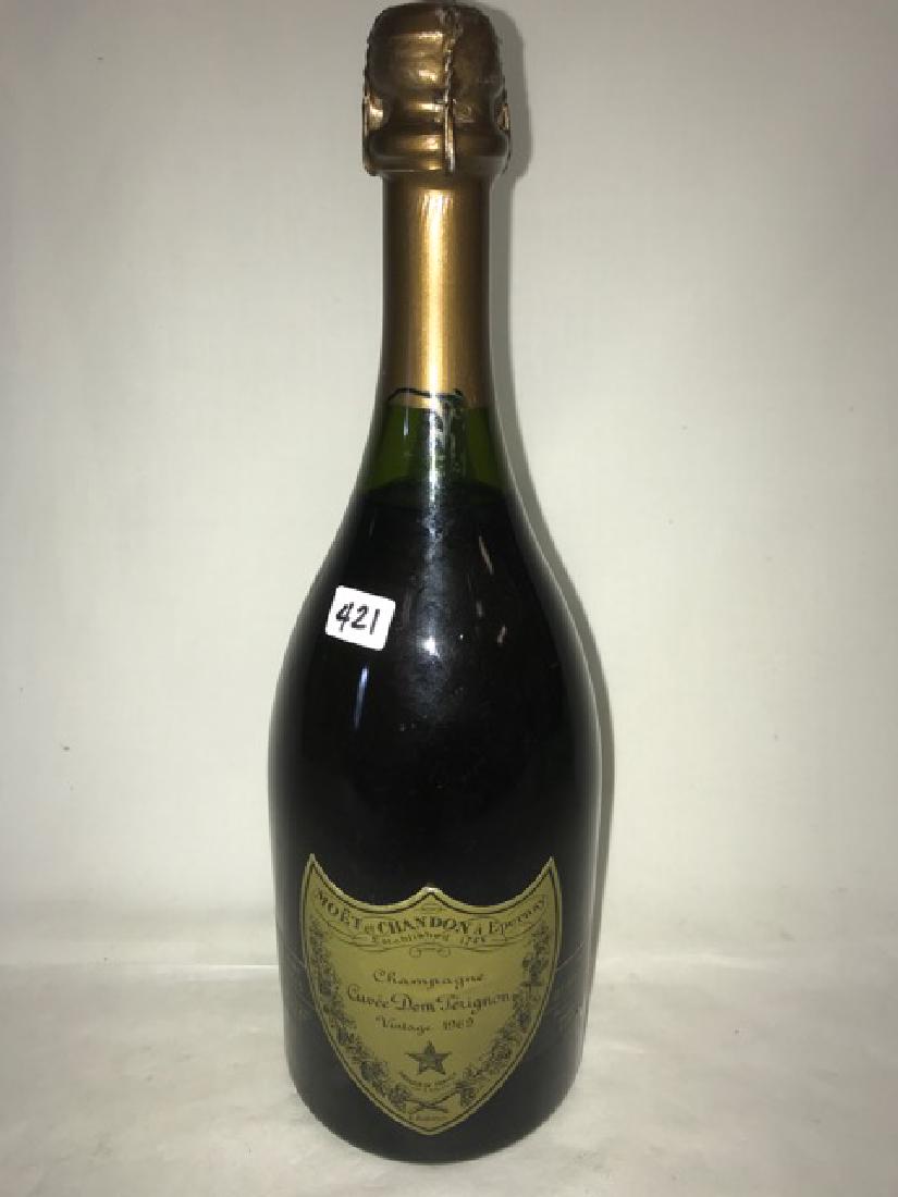 Dom Perignon Champagne: 1969 Champagne Curee Dom Perignon Vintage 1969. Moet et Chandon a Epernay. Product of France. Contents 1 Pint, 10 Fluid Ouncces. Sole United States Distributors Schieffelin and Co. New York 3, NY. Pro