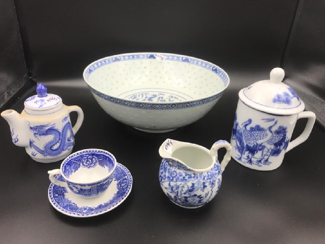 Lot of Blue & White Porcelain Pieces (5): Including a bowl marked Shanghai; a covered mug; a small tea pot made in Taiwan a Republic of China; a cup and saucer marked Arabia Finland; and a cream pitcher. 10" diameter, the bowl.