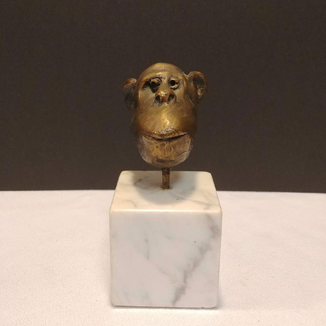 Bronze Monkey Head Marble Base: Cabinet size monkey head on a marble base signed at the back, Steckel, 54. 4-1/2" H includes pedestal base.