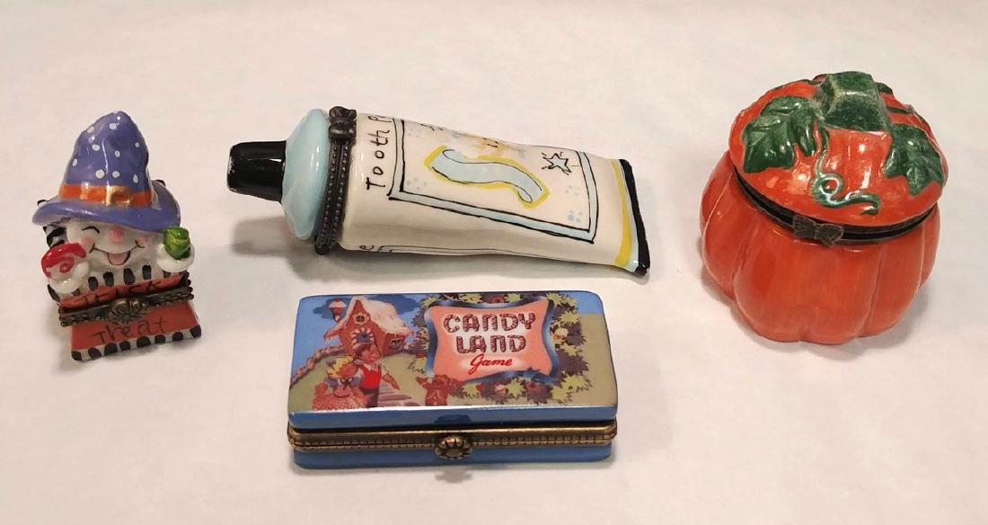 Halloween Themed Trinket Boxes: Porcelain trinket boxes include Pumpkin, Jack in the box with candy corn inside, Candyland game, and a tube of toothpaste. 3-3/4" L the toothpaste.