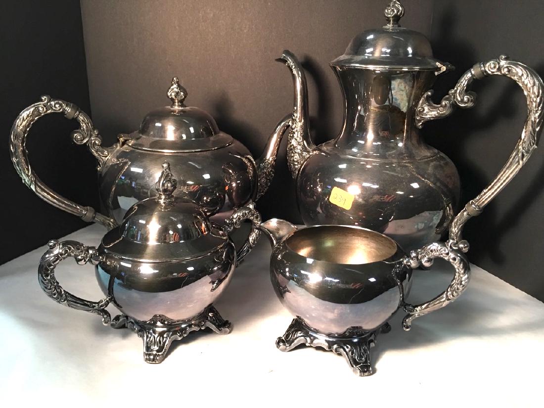 Wm. A. Rogers Silver Plated Tea Service: Nicely chased silver plated tea pot, coffee pot, creamer and covered sugar bowl. 7" H; 9-1/2" H