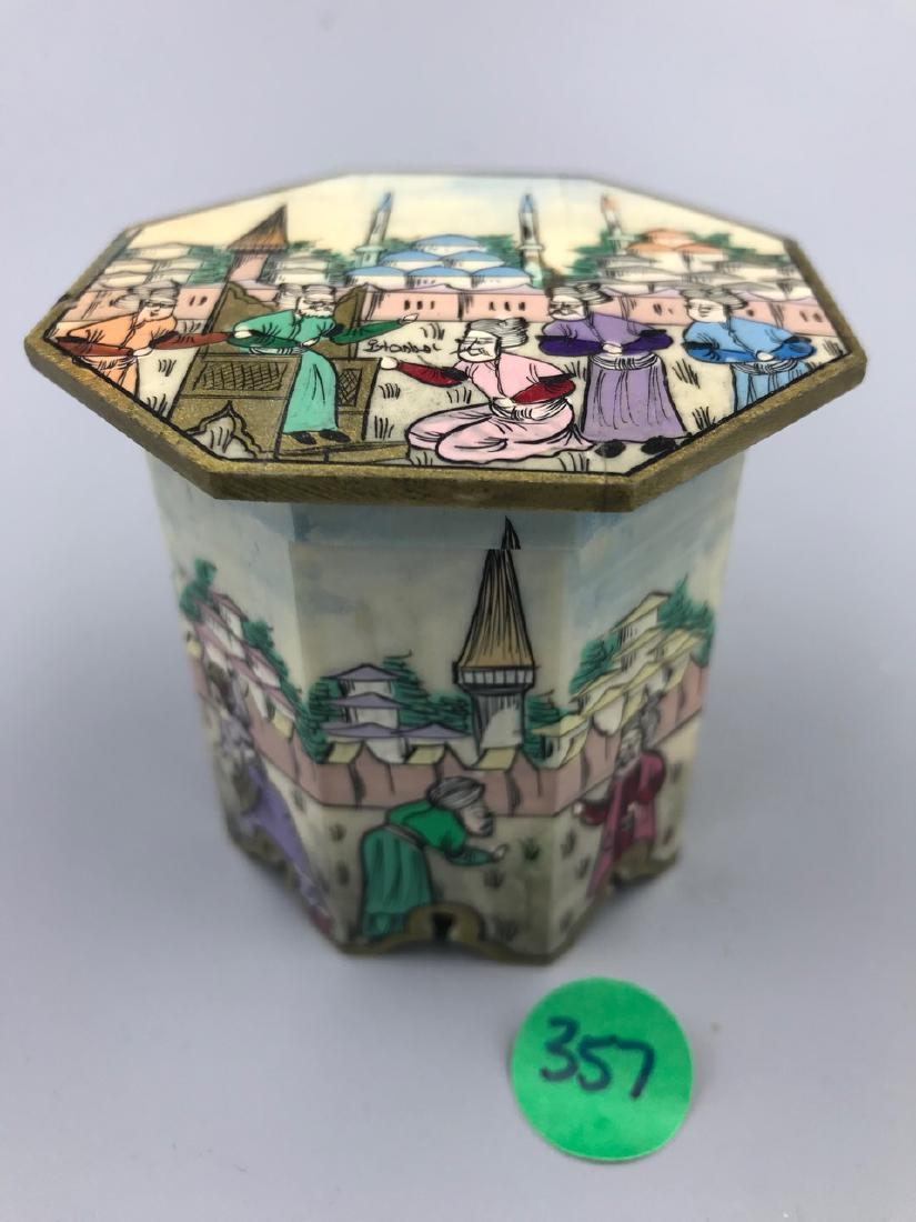 Turkish Camel Bone Hand Painted Trinket Box: Octagonal shaped box with hinged lid. Hand painted scenes of Istanbul. Figures and cityscape. Velvet lined at the bottom inside and out. Marked Istanbul withing the painting on the top of the lid. 3" 