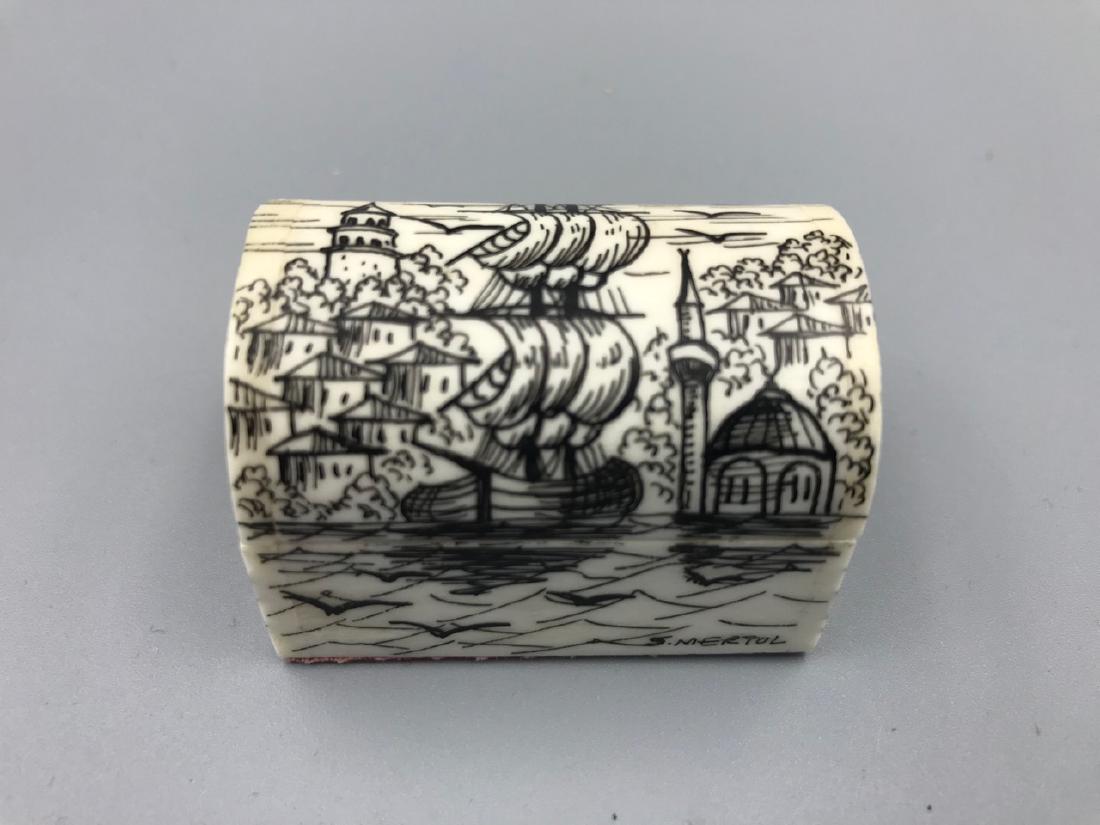 Middle Eastern Camel Bone Trinket Box, Sgd.: Black painted nautical scene on a domed pin hinged lid. Seagulls in the air. Red velvet lined interior and exteior floor. Signed S. Mertol at the front of the box. 1-3/4" L x 1-1/2" W x 1-1/2" H