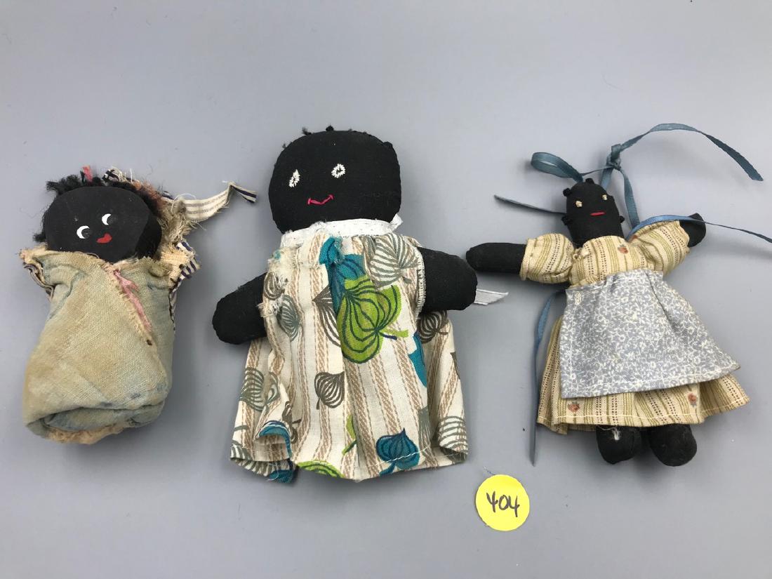 Folk Art Textile Dolls - African American: Largest doll has a tear in her dress as shown in photos; baby is wrapped in an antique quilt piece and had a wooden face. 3-1/2" H to 5" H