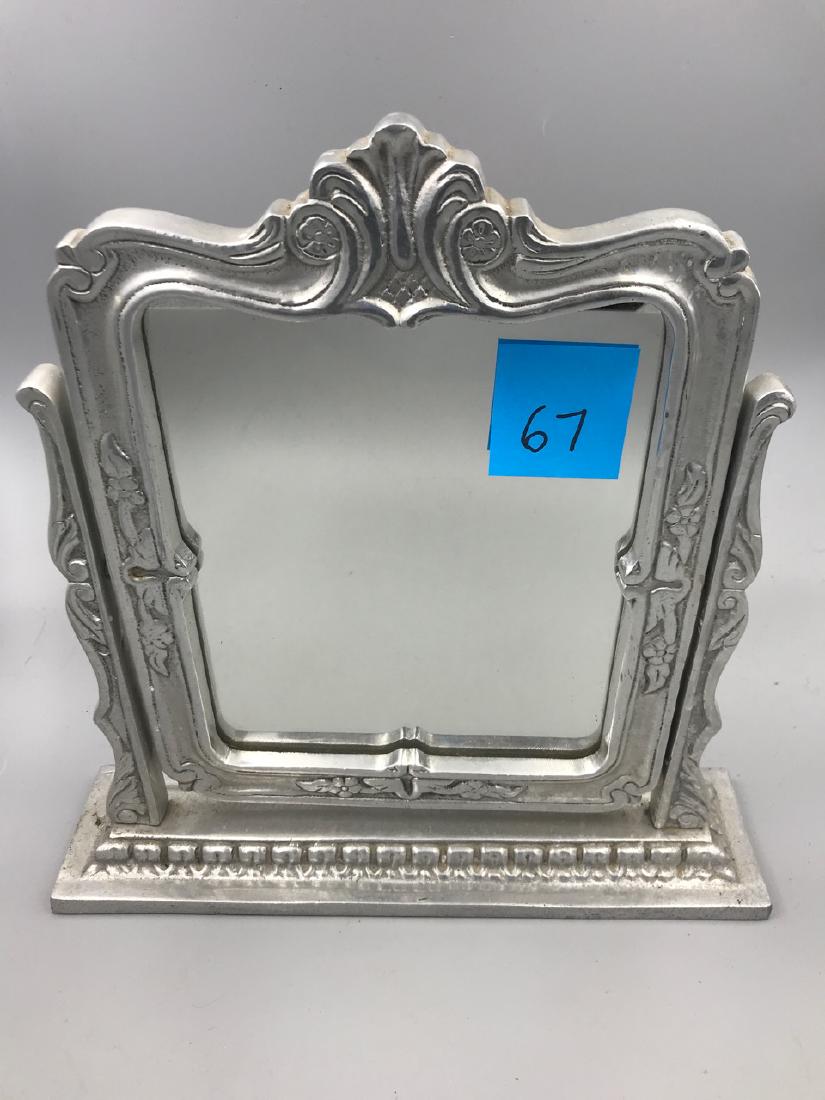 Silvered Fancy Metal Mirror: Swivel flip mirror of considerable weight. 13-3/4" H