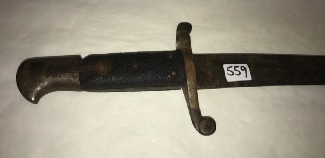 Bayonet No Scabbard: Rusted condition. Marks that resemble a "scales" as shown in photos. No scabbard. 27-7/8" long