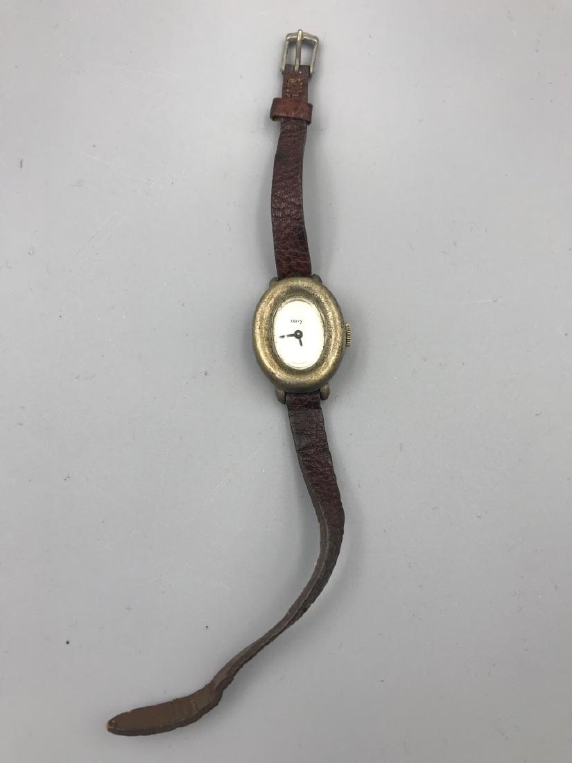 Obrey French Silver Ladies Watch: Oval silver watch marked Obrey, Made in France on the face. The reverse reads Solid Silver, Obrey Paris, Made in France. 1" H