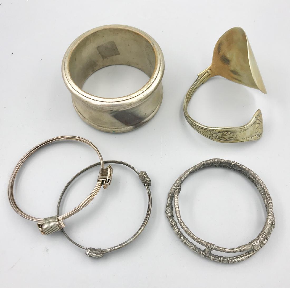 Lot of 5 Metal Bracelets: Two are adjustable; one is a repurposed plated silver spoon (in the Diploma pattern) one is wire wrapped; and the last is thick. 3" D x 1-3/4" Wide (the largest)