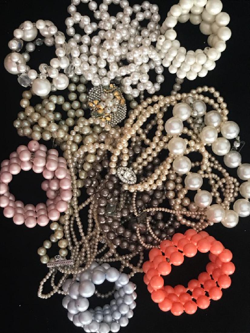Bag Lot of Beads, Faux Pearl Necklaces, Bracelets: Varying sizes. One orange "pop-bead" bracelet.