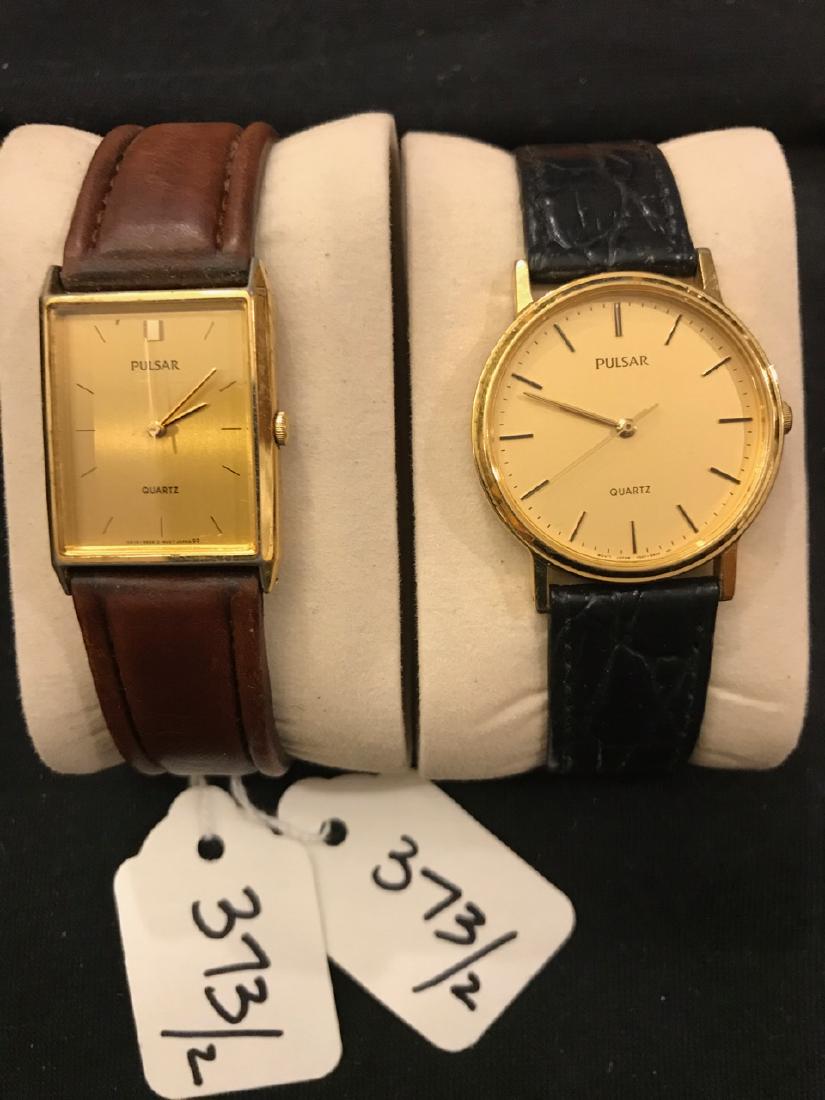 Two Pulsar Mens Watches (2): Gold tone faces, one round and one rectangular. Both are quartz watches with leather bands.