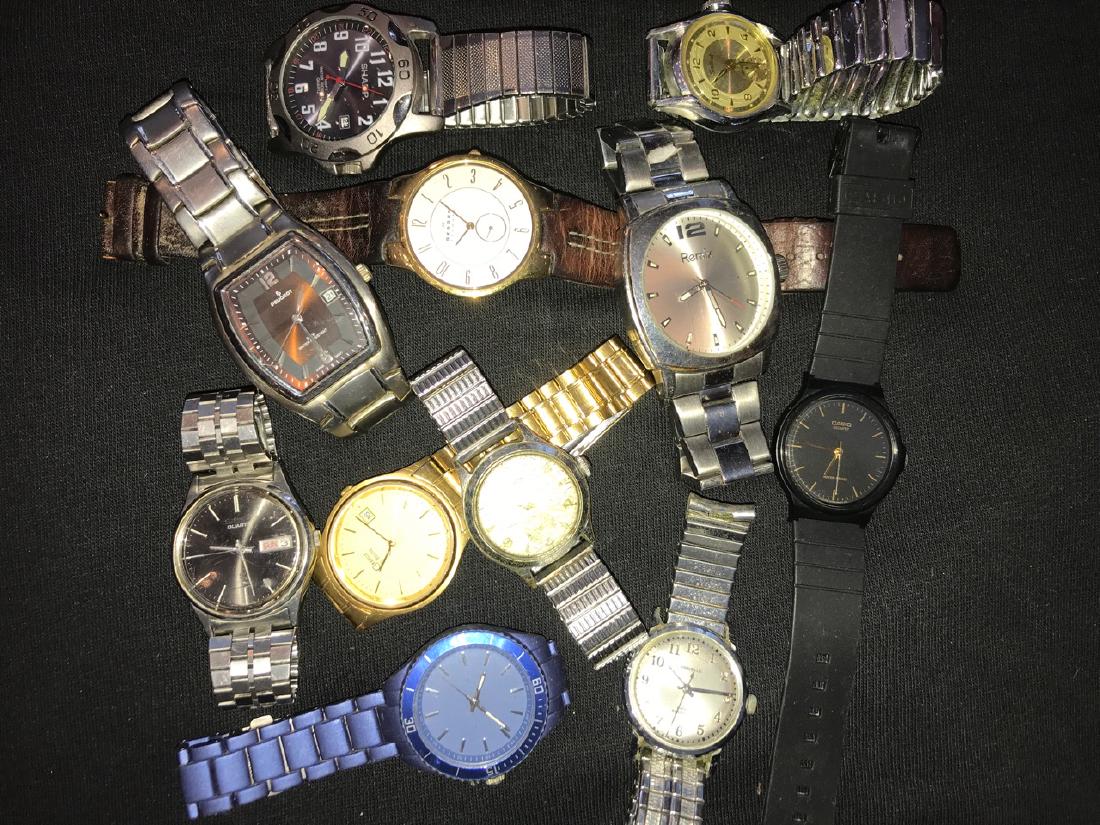 Mens Wrist Watch Lot (12): Caravelle by Bulova; Seattle Sonics NBA in original case; Skagen; Peugeot 140 stainless steel; Sharp; Sentinel; Casio; and others.