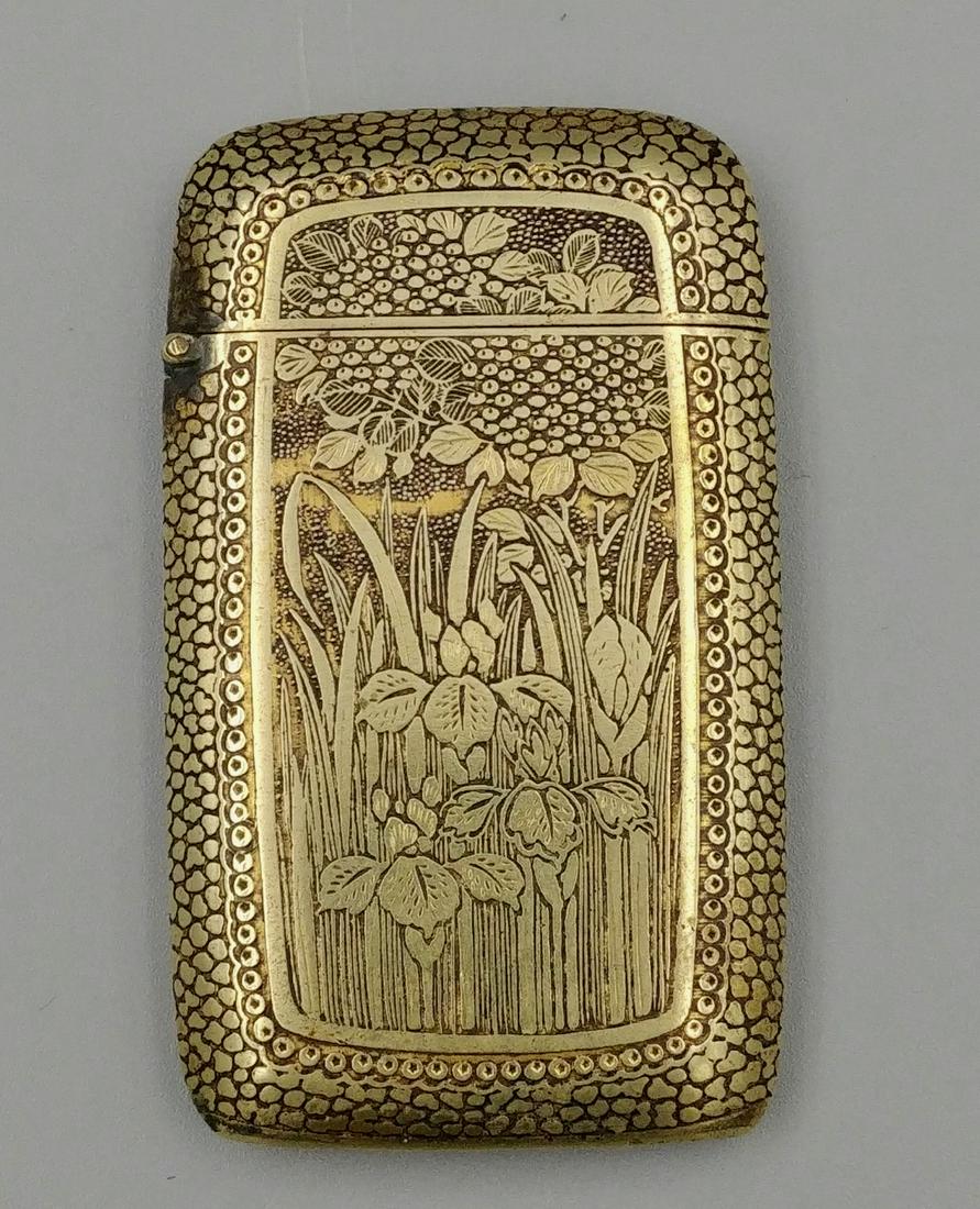 Gold Plated Art Deco Ladies Match Safe: Chased with sunflower and iris on front and wisteria on the reverse. Flip top lid. Striker at the base.
